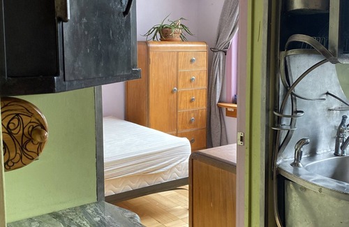 Bushwick Apartment | Metalwork Artist made Master Suite in small brick carriage house