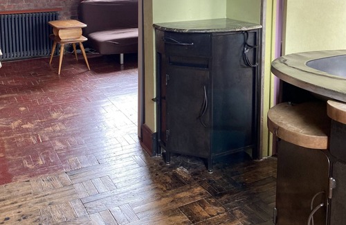 Bushwick Apartment | Metalwork Artist made Master Suite in small brick carriage house
