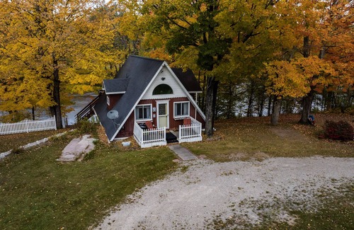 Cornell Ski Chalet | Michigans Upper Peninsula ON the Escanaba River with wooded 5 acres of Privacy.