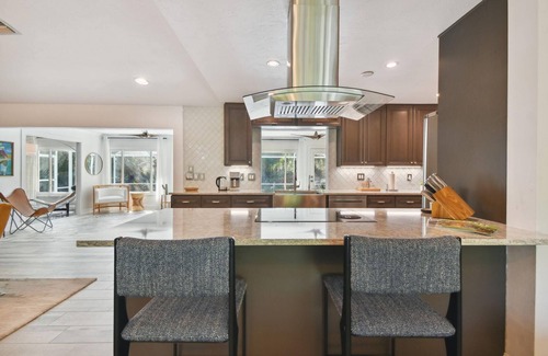 Desoto Lakes House | Mid-Century Modern pool home 3 Bed, 2 Bath home, walkways in the private garden