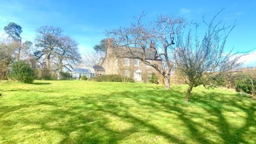Meifod House | Mid-Wales Farmhouse, swimming pool, tranquil countryside views, sleeps 14