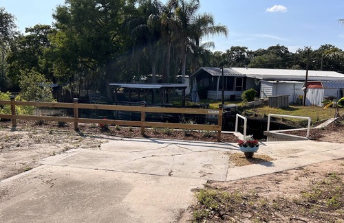 Plymouth House | Mobile Home with canal frontage and access to Harris Chain of Lakes