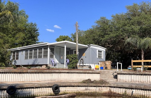 Plymouth House | Mobile Home with canal frontage and access to Harris Chain of Lakes