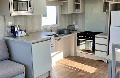 Weymouth House | Modern 2 bedroom caravan. Disabled friendly with wetroom & fab sun deck.