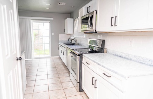 Northeast Carrollton House | Modern 2-bedroom home with loft and indoor fireplace!
