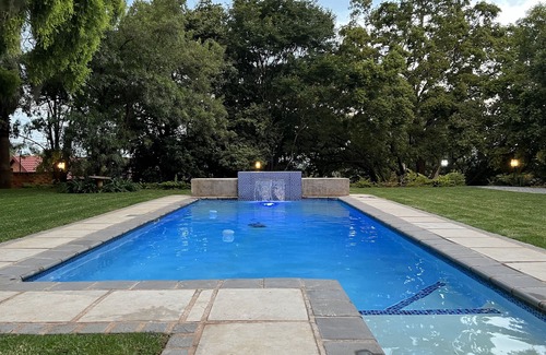 Pretoria Apartment | Modern 4 sleeper private suite and access to beautiful garden and swimming pool
