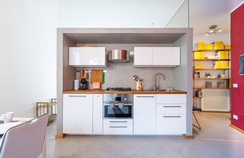 Oltretorrente Apartment | Modern 60 sqm apartment located on the fourth floor of a renovated 30's building without a lift (stairs to access it).The apartment consists of a living room with kitchenette, bedroom and bathroom. The bedroom is inspired by La Chayhana in Uzbekistan, a