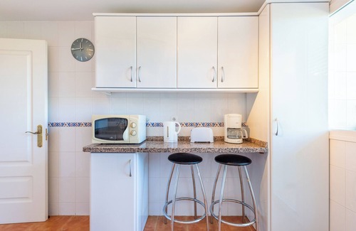 La Cala de Mijas Apartment | Modern Apartment 'In Jardin Botanico' with Sea View, Pool, Wi-Fi, Garden & Terrace