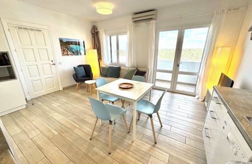 Cala en Porter Apartment | Modern apartment with a fantastic view over the bay