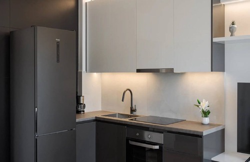Vouliagmeni Villa | Modern Athens Apartment | Apartment Luxe | 1 Bedroom | Balcony with Garden.