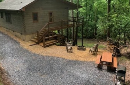 Hidden Lake Cabin | Modern cabin in the woods with private hot tub, firepit, picnic area, AC & WiFi
