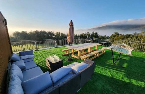 Stamford Villa | Modern Catskill House & Lake NY with hot tube on the roof