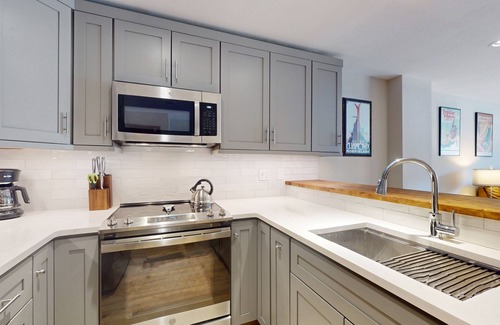 Avon Condo | Modern condo steps to gondola & lake w/view & patio - in heart of everything