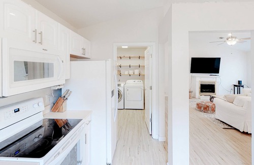 Gulfview Heights House | Modern dog-friendly home near the Gulf with yard, grill, screened porch & bikes