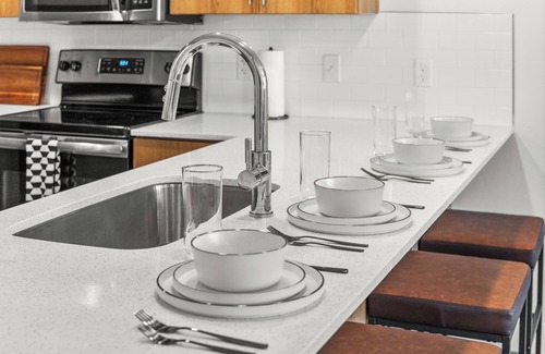 Rio Grande Apartment | Modern Downtown 2BR 2BA Near Delta Center with Fire Pit, BBQ, and City Views