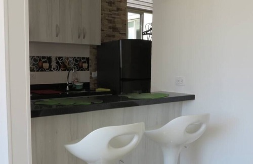 Girardot Condo | Modern Elegance | Gem with Balcony and Four Pools