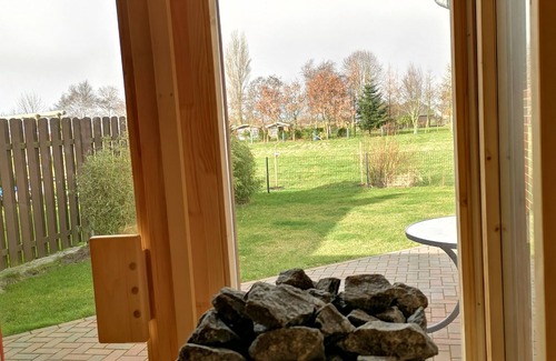 Norden Apartment | Modern first floor apartment with sauna and beach chair in the garden for 4 persons