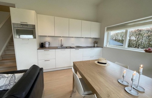 Langweer House | Modern holiday home with large garden overlooking the beach at Langweerder Wielen