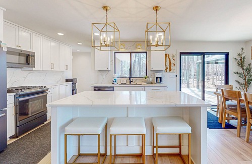 Bellaire House | Modern Home in the woods w/a large patio, gas grill, & near the lake