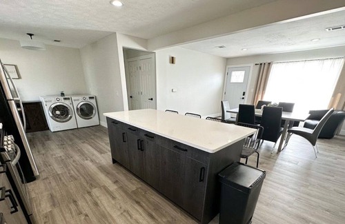 Lincoln House | Modern Home near downtown and UNL with Firepit, BBQ Grill & Air Hockey!