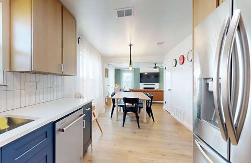Scofield Farms House | Modern home with an enclosed backyard with wood fire pit in North Austin