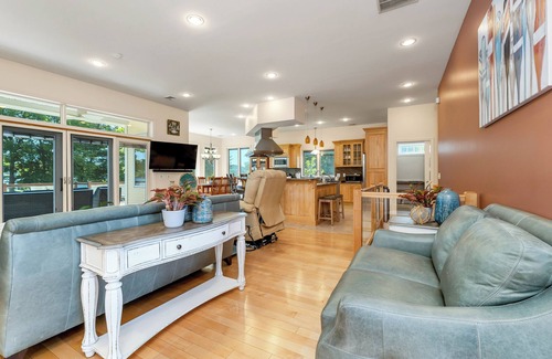 Laconia House | Modern Lake Opechee Home features Sandy Perched Beach and Dock