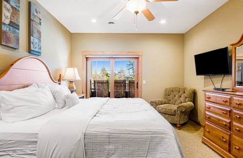 Three Lakes Condo | Modern, lake-view condo with loft, balcony, fireplace, pool & hot tub access