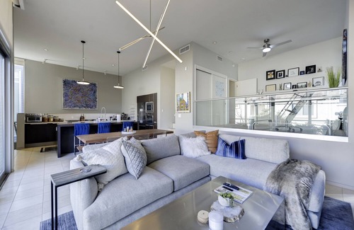 Camelback East House | Modern luxury loft with Floor to Ceiling windows. West Elm/CB2