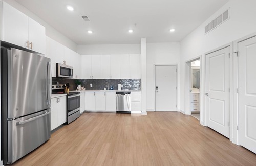 Downtown Louisville Apartment | Modern Nulu 2BR CozySuites 02