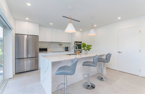 Imperial Point House | Modern Oasis, Heated Pool, Short Drive to Beach