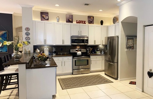 Lake Ida Shores House | Modern Oasis in Delray Beach: Steps from the Sand