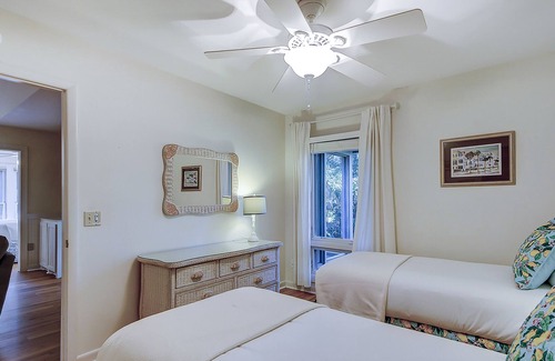 West Beach Condo | Modern, one-level condo near beach & golf with deck, sunroom, & pool