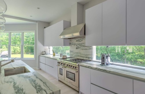 Amagansett North House | Modern-style home with heated private pool, open-floor plan, ample natural.