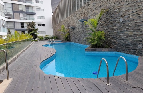 Santiago de Surco Apartment | Modern Suite with a Pool & Gym in Surco