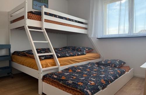 Dierikon Apartment | Moderne Familienwohnung mit Garten & E-Ladestation