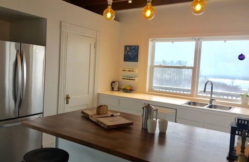 Amherst House | Modernized Waterfront Farmhouse with Wood Stove on 9 Acres of Land