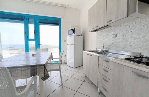 Posto Rosso House | MONOLOCALE LA CORTE SUL MARE