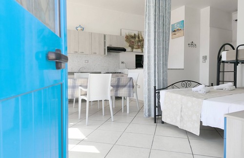 Posto Rosso House | MONOLOCALE LA CORTE SUL MARE