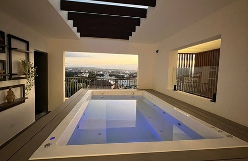 Santiago Province Condo | Monumental Suite: Elegant Modern Apt, Stunning City Views & Rooftop Pool.