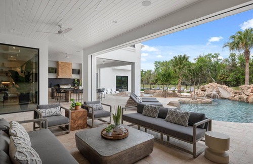 Reunion House | Morlando Three floor rocket ship, luxurious interior, back yard oasis with pool