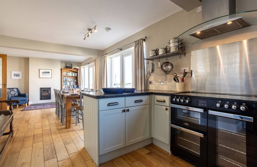 Rhosneigr House | Morwennol : Spacious 5‑Bed Pet-Friendly Home 50m from Rhosneigr Beach | Managed by Anglesey Holiday