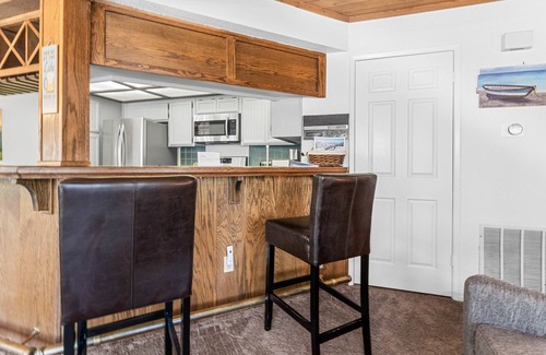 Big Bear Lake House | Mountain Condo has King Suite, Soaking Tub, Arcade, Pool and Hot Tub Access!