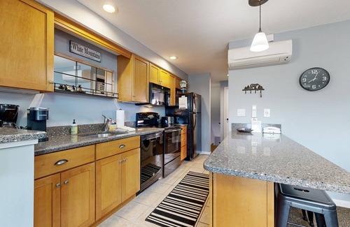 Jackson Condo | Mountain stunner with pools, hot tub, tennis, grilling area, & game tables