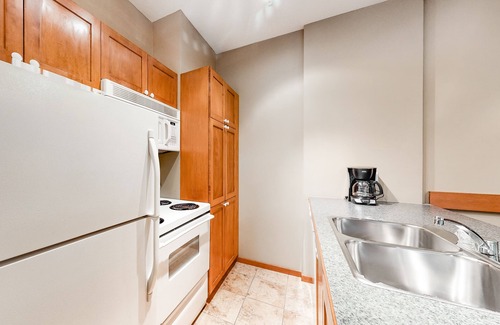 Village North Condo | Mountain view condo with hot tubs, outdoor pool & gym - walk to lifts