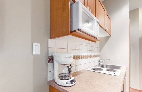 Village North Condo | Mountain view condo with hot tubs, outdoor pool & gym - walk to lifts