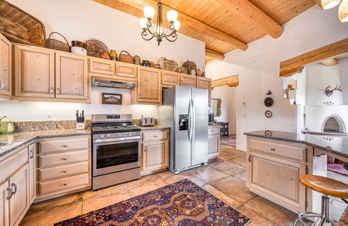 Taos House | Mountain view home with a fireplace, hot tub, washer/dryer & gas grill