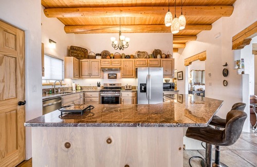 Taos House | Mountain view home with a fireplace, hot tub, washer/dryer & gas grill