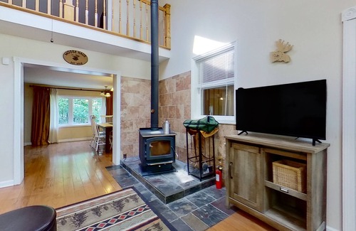Warrensburg House | Mountain-view house with wood-burning fireplace, deck, patio, & washer/dryer