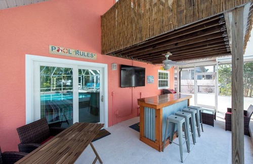 East Naples House | Naples Beach Escape | Pool, Canal Views & Tiki Vibes Near Pier & 5th Avenue