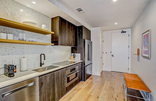 Rainey Street Historic District Apartment | Natiivo Austin studio - lake & skyline-view balcony, pool & gym - dogs OK